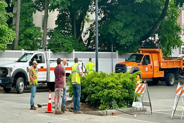 DPW workers installing the foundation for the parking kiosks at the Brande Court lot in June 2023.