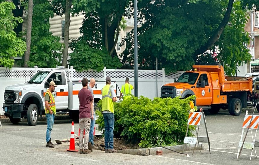 DPW workers installing the foundation for the parking kiosks at the Brande Court lot in June 2023.